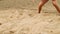 Detail of volleyball female player at the beach. Scene. Close-up of a woman on the sand playing beach volleyball