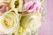 Detail of wedding bouquet on pink background, pink and ivory bouqet, holiday celebration