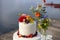 detail of the wedding cake with redberries and flowers