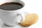 Detail of a white ceramic cup of black coffee with shortbread bi