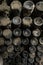 Detail of wine bottles covered in dust aging in wine cellar