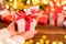 Detail of woman hands holding Christmas gift