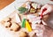 Detail of a woman\'s hand which is decorating Christmas cookie