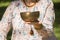 Detail of a woman`s hands holding a Tibetan singing bowl