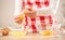 Detail of woman`s hands separating egg yolks from the whites into two glass bowls