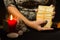 Detail of a woman`s hands shuffling tarot cards