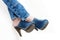 detail of woman wearing denim clogs