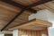 Detail of wood beam ceiling in a modern house entryway