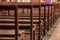 Detail of wooden benches inside a church