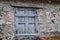 Detail of wooden window in a demolished stone house