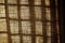 detail of woven curtain texture with sunbeam silhouette, crisp play of light