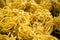 Detail of yellow noodles drying. Sumatra
