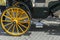 Detail of yellow wheel of horse carriage in Seville Spain