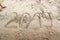 Detail of young boy`s legs standing near 2019 written on the sea sand with drawn heart in number 0