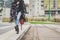 Detail of a young woman posing in the city streets