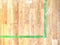 Detailed abstract view of a painted hardwood court, border lines