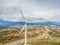 Detailed aerial view, by drone, of a wind turbines on top of mountains