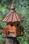 Detailed bird house on a green background