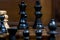 Detailed close up of chess figures - black king, queen, rook, pawn