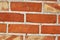 Detailed close up of colorful aged and weathered brickwall in high resolution