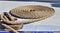 Detailed close up detail of ropes and cordage in the rigging of an old wooden vintage sailboat