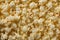 A detailed close-up image showcasing a pile of popcorn up close, The puffy texture of popcorn, AI Generated