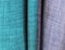 Detailed close up view on colorful fabric textile textures with lots of structure