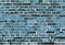 Detailed close up view on weathered blue brick walls at aged buildings in high resolution