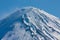 A detailed closeup of the peak of the highest mountain in Japan, Mt. Fuji or Fujisan, at the beginning of spring