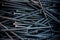 Detailed dark background and texture full frame of pile metal steel nails for construction of carpenter