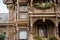 detailed exterior of victorian house, with intricate gingerbread and floral details