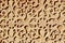 Detailed geometrical ornate of vivid beige colour with shadow in arab district downtown Segovia, Spain