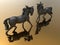 Detailed horse statuettes with reflections