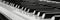 Detailed monochrome close up of a black and white piano keyboard in a striking image