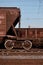 Detailed photo of railway freight car. A fragment of the component parts of the freight car on the railroad in dayligh