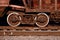 Detailed photo of railway freight car. A fragment of the component parts of the freight car on the railroad in dayligh