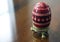 Detailed Red Pysanky Ukrainian Easter Egg on a Wooden Table