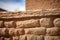 detailed shot of an adobe brick in a pueblo wall