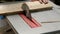 Detailed shot of rotating circular saw disc in motion, carpenter working close up