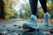 A detailed shot showcasing the running shoes of a person with tightly tied laces, ready for a workout or a jog, A runner\\\'s