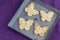 Detailed Top View Four biscuits cookies with lavender on an Sheet tray