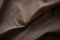 A detailed, up-close image capturing the texture and color of a brown fabric, The matte and fibrous texture of a canvas bag, AI