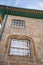 Detailed view of classic building with a gothic ornamented window, portuguese manuelino style, stone facade