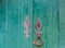 Detailed view of a classic door lock on old wooden door
