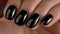 Detailed view of elegant woman s hand with chic black nail polish for a glamorous look
