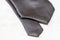 Detailed view on ends of gray necktie