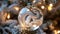 Detailed view of a glass holiday ornament with a frosted snake motif, illuminated by subtle fairy lights, creating a