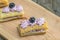 Detailed view on puff pastry tasty with blackberry-mascarpone