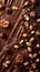A detailed view of a rich chocolate cake topped with a generous amount of crunchy nuts, creating a delectable dessert
