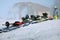 Detailed view of the ski bindings and skis lying on the piste